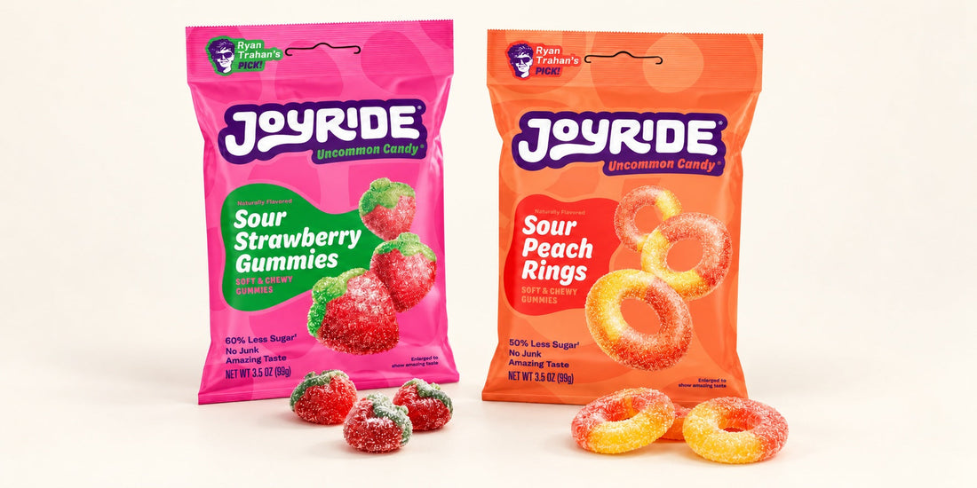 JOYRIDE Strawberry Gummies and Peach Rings with loose candy on a plain off-white studio backdrop